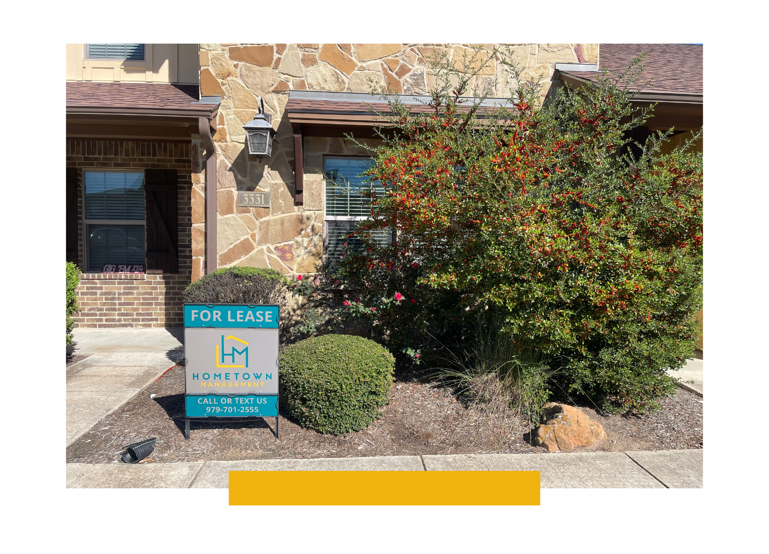 A Hometown Management 'For Lease' sign in front of a managed home in Bryan, Texas